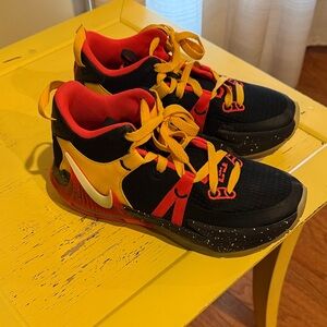 Nike Kids Black and Red Sneakers with Yellow Accents